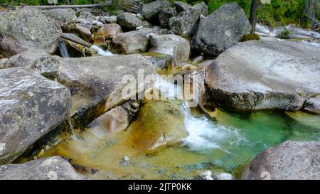 Slovak mountain river Studena in the High Tatras. A river with very clear mountain water and many waterfalls. Stock Photo