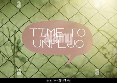 Sign displaying Time To Unplug, Business idea Relaxing giving up work disconnecting from everything Businessman in suit holding open palm symbolizing Stock Photo