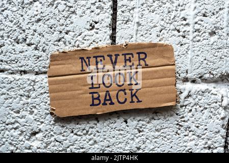 Sign displaying Never Look Back, Business showcase Do not have regrets for your actions be optimistic Businessman Pointing Important Informations With Stock Photo