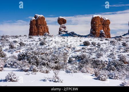 Balanced Rock after a winter snowfall in Arches National Park, Moab, Utah. Stock Photo