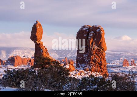 Balanced Rock after a winter snowfall in Arches National Park, Moab, Utah. Stock Photo