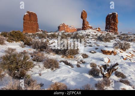 Balanced Rock and Owl Rock after a winter snowfall in Arches National Park, Moab, Utah. Stock Photo