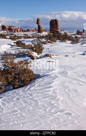 Balanced Rock after a winter snowfall in Arches National Park, Moab, Utah. Stock Photo