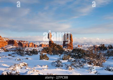 Balanced Rock after a winter snowfall in Arches National Park, Moab, Utah. Stock Photo