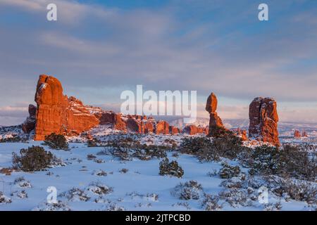 Balanced Rock and Owl Rock after a winter snowfall in Arches National Park, Moab, Utah. Stock Photo