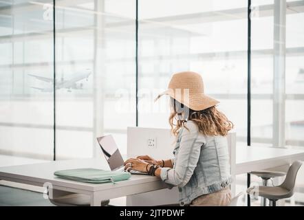 Anonymous female freelancer working in airport Stock Photo