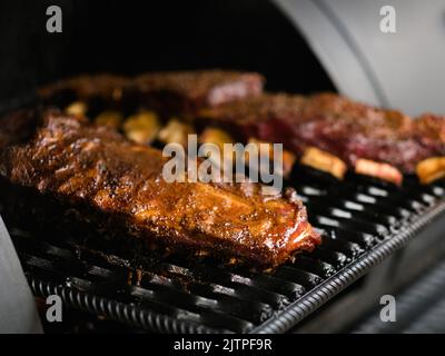 professional kitchen appliance ribs bbq smoker Stock Photo