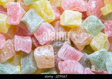 Closeup of multicolored cubes Turkish delight (Lokum). Selective Focus. Flat lay. Stock Photo