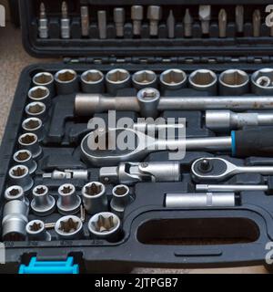 A set of socket wrenches. Locksmith tools in a box. A tool for car repair. Selective focus Stock Photo
