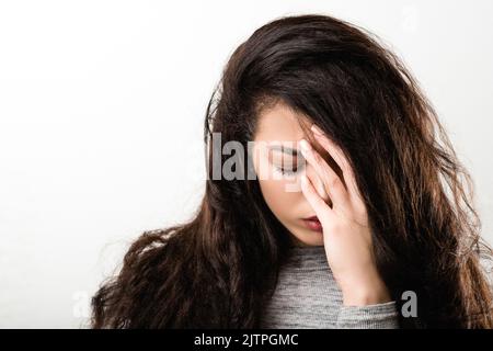 grieving sorrowful regretful emotional girl Stock Photo