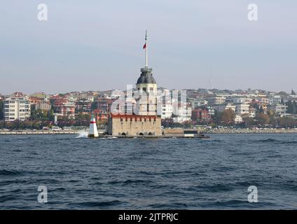 ISTANBUL,TURKEY-NOV 02: Maiden's Tower aka Kiz Kulesi with Buildings of Uskudar  Background from a Ferry. November  02,2021 in Istanbul, Turkey Stock Photo