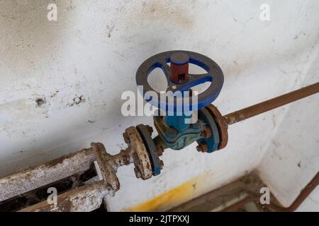 Old rusted heater valve with pipe Stock Photo