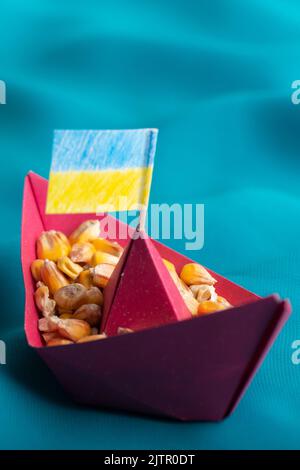 Ships with Ukrainian maize grain made of paper concept Stock Photo