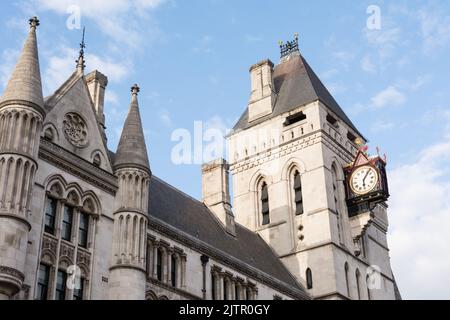 The clock face and tower on the Royal Courts of Justice, Fleet Street, London, England, UK Stock Photo