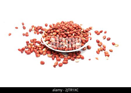 Peanuts / Moongfali in plate isolated on a white background Stock Photo