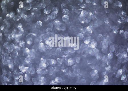 Abstract festive elegant gray background of blurred with bokeh lights and stars texture Stock Photo