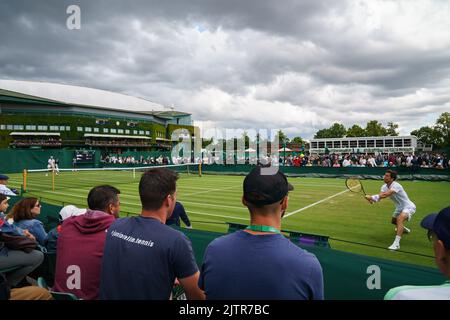 General Views of Maxamillion Marterer and Aljaz Bedene on Court 8 at The Championships 2022. Held at The All England Lawn Tennis Club, Wimbledon. Stock Photo