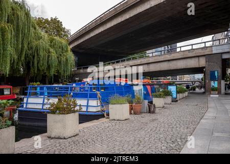 Paddington Basin, London. A regenerated area of Paddington, along the canal, with a walkway, cafes and restaurants along with modern apartments. Stock Photo