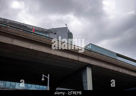 Paddington Basin, London. A regenerated area of Paddington, along the canal, with a walkway, cafes and restaurants along with modern apartments. Stock Photo