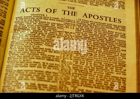 Close up of antique Holy Bible page, shallow depth of field with focus on chapter title heading, Acts of the Apostles Stock Photo