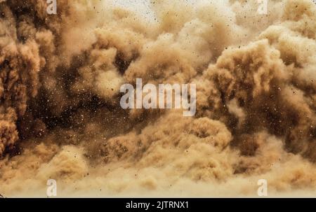 Close up of dust storm and flying rock particle after dynamite blast o the mining site in the Oman Stock Photo