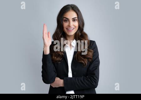 Portrait of young woman pointing her finger in eureka sign, having great innovative idea, solution just got. Happiness business woman face. Stock Photo