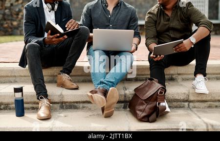 Casual guys, young men or students, outdoors on business, education or college campus talking and discussing ideas during break. Creative team has an Stock Photo