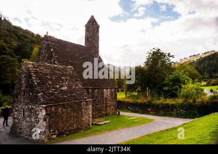 Stone roof and round tower of St. Kevins KItchen in Glendalough, Ireland. Stock Photo