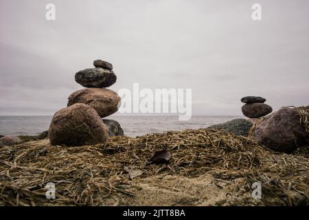 Stone towers on the beach of the Baltic Sea Stock Photo
