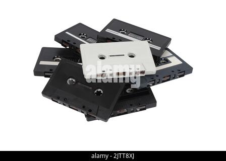 A pile of old cassette tapes, isolated on white with path cut out Stock Photo