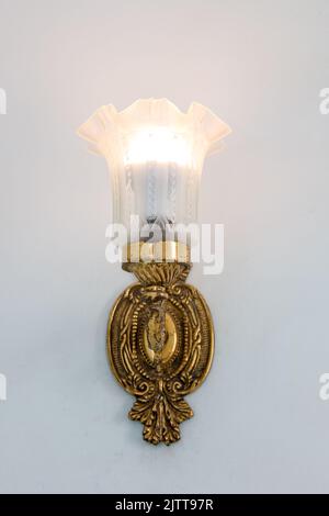 antique chandelier on a white wall in Rio de Janeiro. Stock Photo