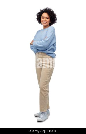 happy smiling woman in blue sweater and jeans Stock Photo