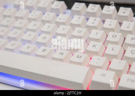 white gamer keyboard with colorful lights in rio de janeiro brazil. Stock Photo
