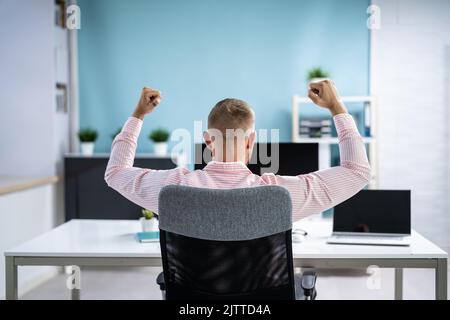 Happy Business Man With New Job Using Business Computer Stock Photo