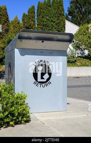 Bellingham, WA, USA - August 30, 2022; Library return box with text and logo Stock Photo