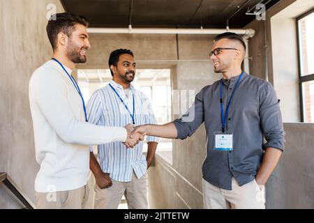 happy businessmen making handshake at office Stock Photo