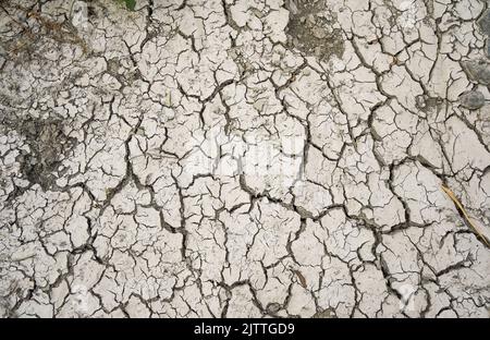 Cracked ground in a Dry riverbed, Rio Fuengirola, Andalusia, Spain. Stock Photo