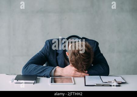 office routine tired young manager sleeping work Stock Photo