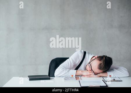 overloaded schedule routine sleeping tired guy Stock Photo