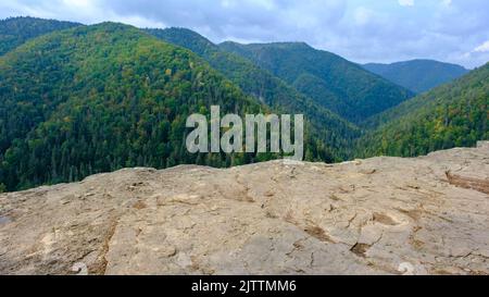 A view of the most beautiful mountains in a panoramic scene. View from Tomasovsky Vyhlad in Slovak Paradise National Park. A blue haze is in the air Stock Photo