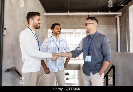 happy businessmen making handshake at office Stock Photo