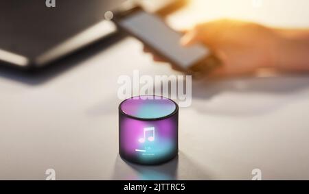 smart speaker with virtual music note hologram Stock Photo