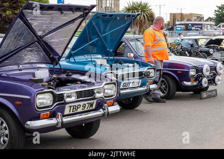 Ford Escort Mark I cars on show on Marine Parade, Southend on Sea, Essex, UK. Classic Cars on the Beach show 'n' shine event, visitor attraction Stock Photo