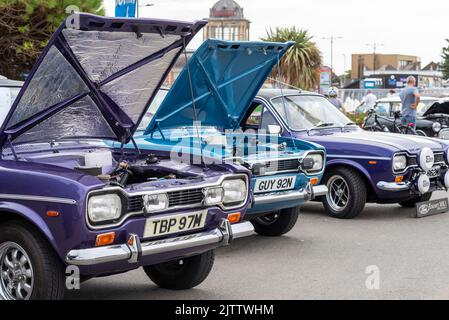 Ford Escort Mark I cars on show on Marine Parade, Southend on Sea, Essex, UK. Classic Cars on the Beach show 'n' shine event, visitor attraction Stock Photo