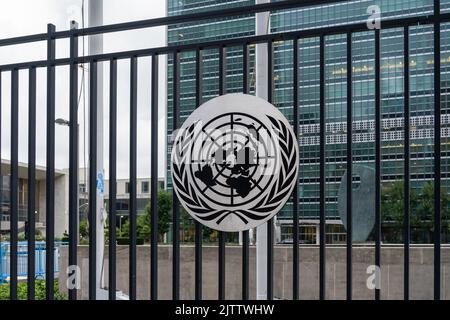 New York City, NY, USA - August 22, 2022: United Nations logo on the fence outside its headquarters in New York City, NY, USA. Stock Photo