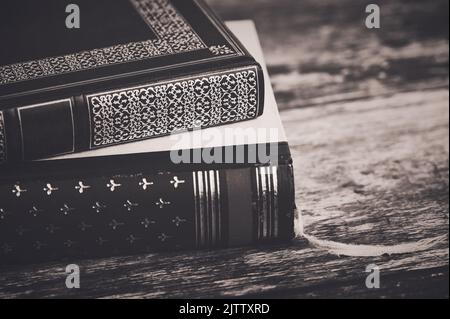 two old books on wooden background in a brown vintage style Stock Photo
