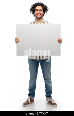smiling man in glasses holding big white board Stock Photo