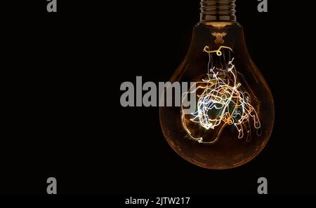 Electric light bulb on the dark background. High quality photo Stock Photo