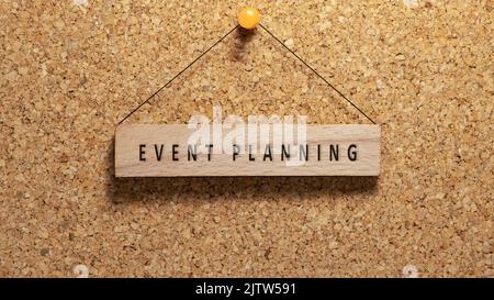 Event planning was written on the wooden surface. Wooden concept. Work and education, personal development. Stock Photo