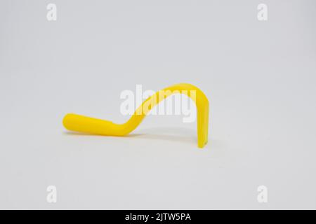 object known as a tick remover, used to remove ticks from people's bodies Stock Photo